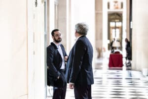 David Guiraud and Éric Coquerel in the corridors of the French idir hakim photographe paris